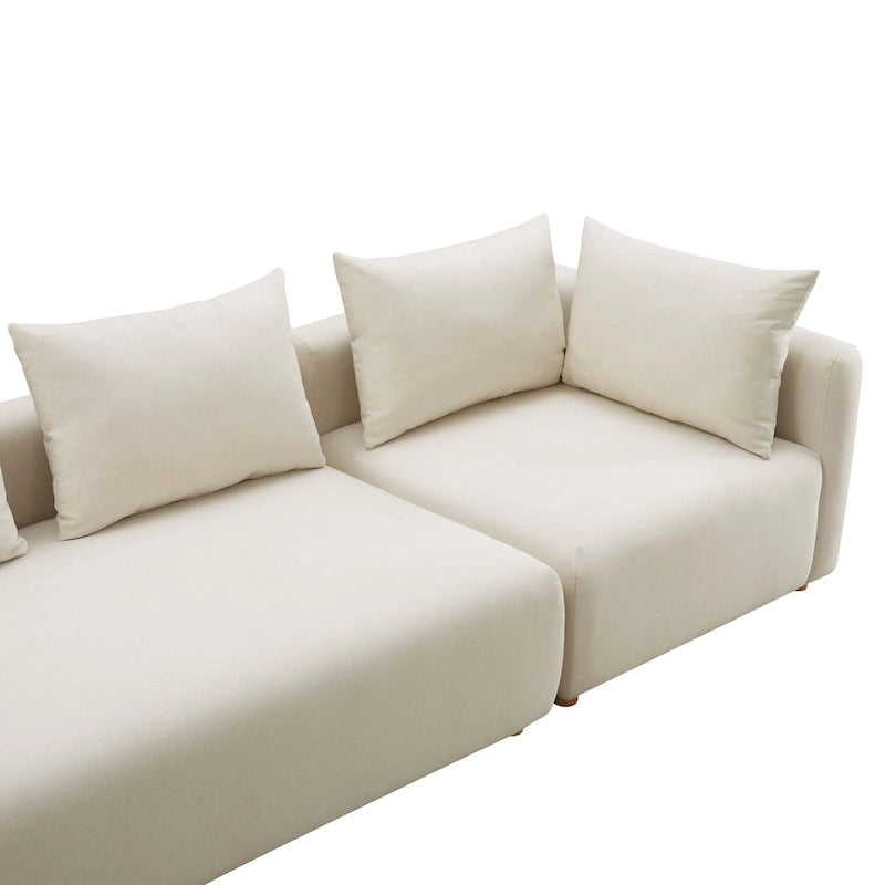 Canapé long tapissé couleur crème