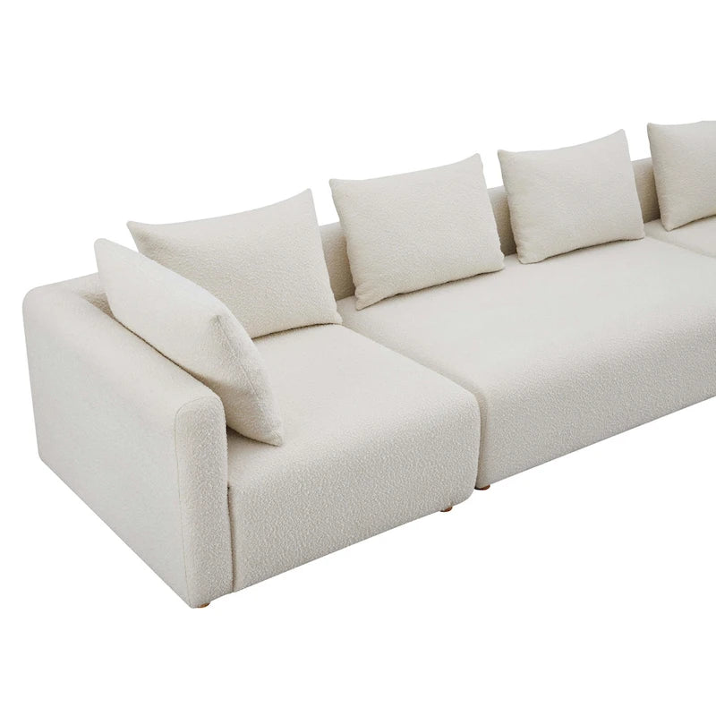 Canapé long tapissé couleur crème